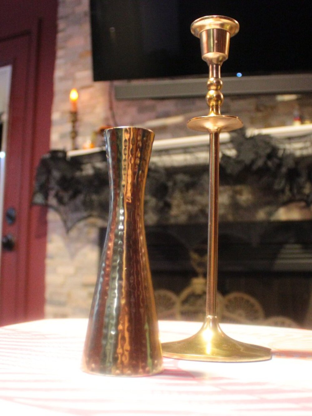 two gold candle stick holders